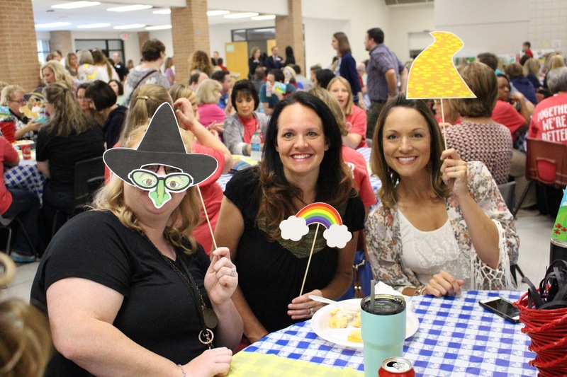 RSD employees pose with wizard of oz photo props at Back to School Breakfast.